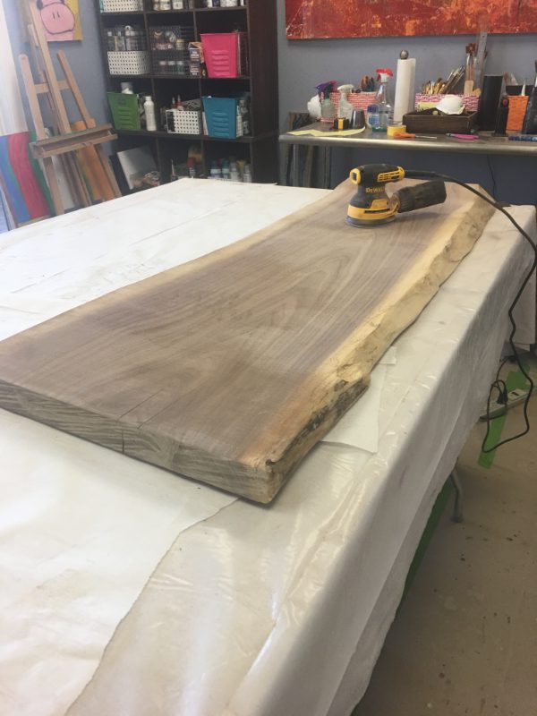 A table with a wood slab on it
